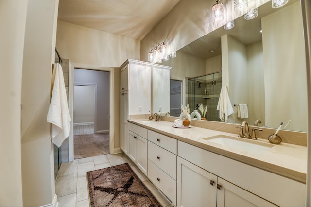 17796 Junelle Ct, Lakeville, MN 55044 - bathroom with a shower stall, tile patterned flooring, and double vanity