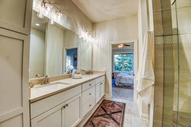 17796 Junelle Ct, Lakeville, MN 55044 - ensuite bathroom featuring double vanity, an enclosed shower, a ceiling fan, and tile patterned flooring