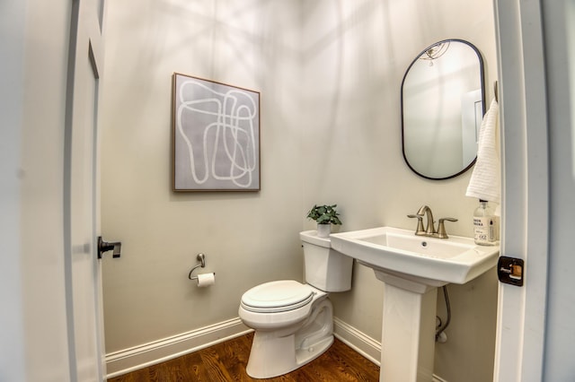 17796 Junelle Ct, Lakeville, MN 55044 - half bath featuring toilet, baseboards, wood finished floors, and a sink