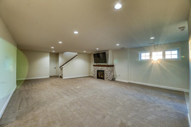 17796 Junelle Ct, Lakeville, MN 55044 - basement featuring recessed lighting, carpet, stairway, baseboards, and a fireplace