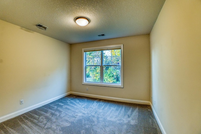 17796 Junelle Ct, Lakeville, MN 55044 - empty room with baseboards, dark colored carpet, and a textured ceiling