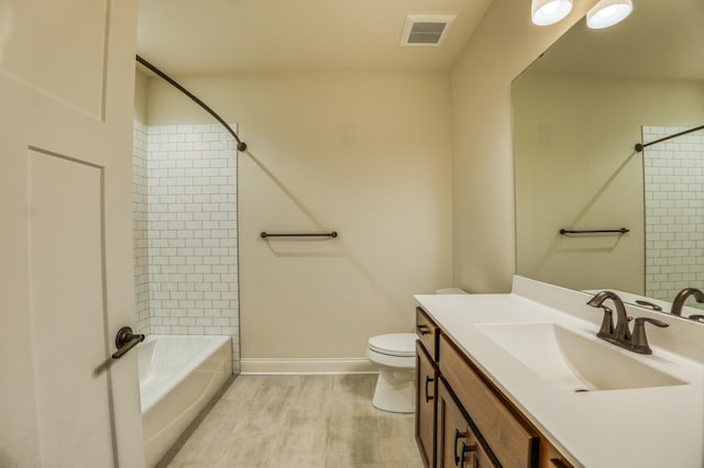 17796 Junelle Ct, Lakeville, MN 55044 - full bath with toilet, shower / washtub combination, vanity, wood finished floors, and baseboards