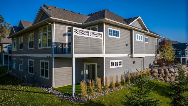 17796 Junelle Ct, Lakeville, MN 55044 - back of house featuring a balcony, a lawn, and a shingled roof