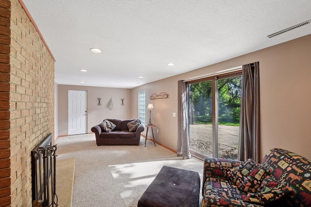 7081 Shawnee Ln, Chanhassen, MN 55317 - living room featuring carpet flooring, recessed lighting, a textured ceiling, a brick fireplace, and baseboards