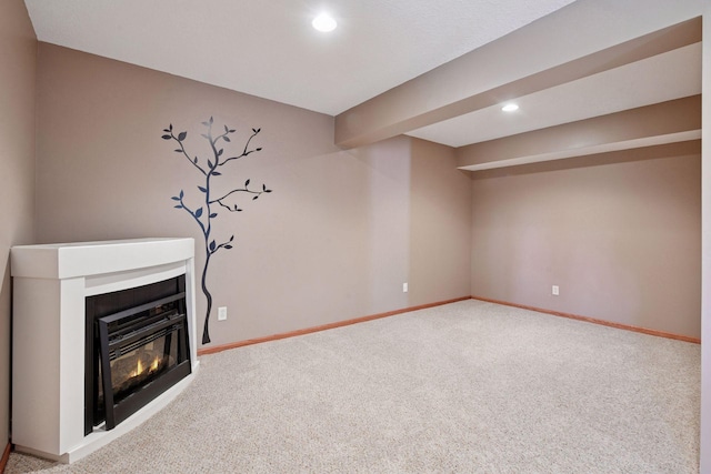 7081 Shawnee Ln, Chanhassen, MN 55317 - unfurnished living room featuring carpet flooring, baseboards, a glass covered fireplace, and recessed lighting