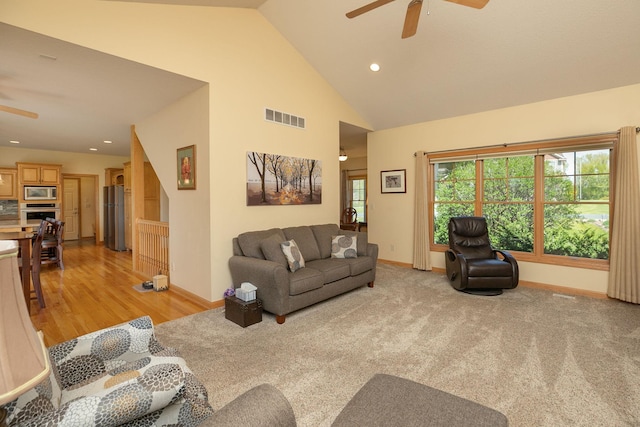 770 Valley View Rd SW, Oronoco, MN 55960 - living area featuring a ceiling fan, baseboards, recessed lighting, high vaulted ceiling, and light wood-style floors