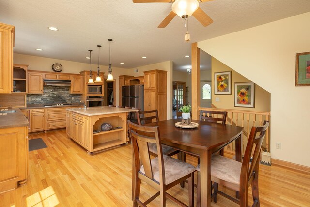 770 Valley View Rd SW, Oronoco, MN 55960 - dining space with light wood finished floors, a ceiling fan, and recessed lighting