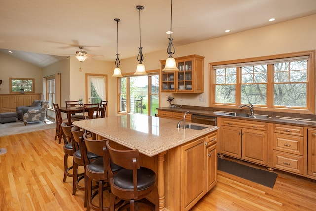770 Valley View Rd SW, Oronoco, MN 55960 - kitchen with light wood-style flooring, an island with sink, a sink, ceiling fan, and recessed lighting