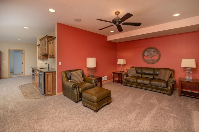 770 Valley View Rd SW, Oronoco, MN 55960 - living area featuring light carpet, wet bar, recessed lighting, ceiling fan, and baseboards
