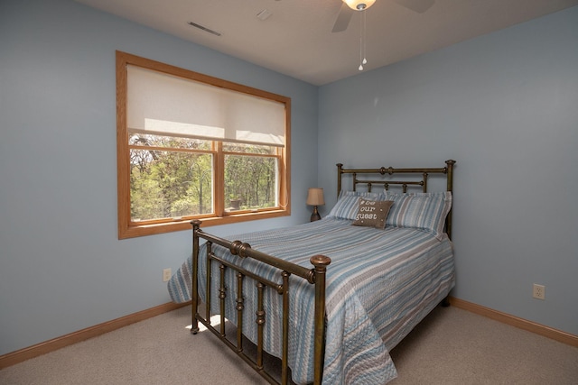 770 Valley View Rd SW, Oronoco, MN 55960 - carpeted bedroom with baseboards and a ceiling fan