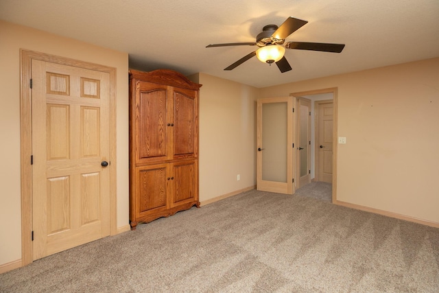 770 Valley View Rd SW, Oronoco, MN 55960 - unfurnished bedroom with light colored carpet, baseboards, and a ceiling fan