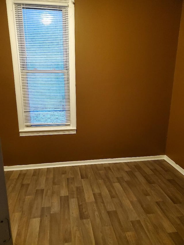 4422 Bryant Ave N, Minneapolis, MN 55412 - unfurnished room featuring wood finished floors and baseboards