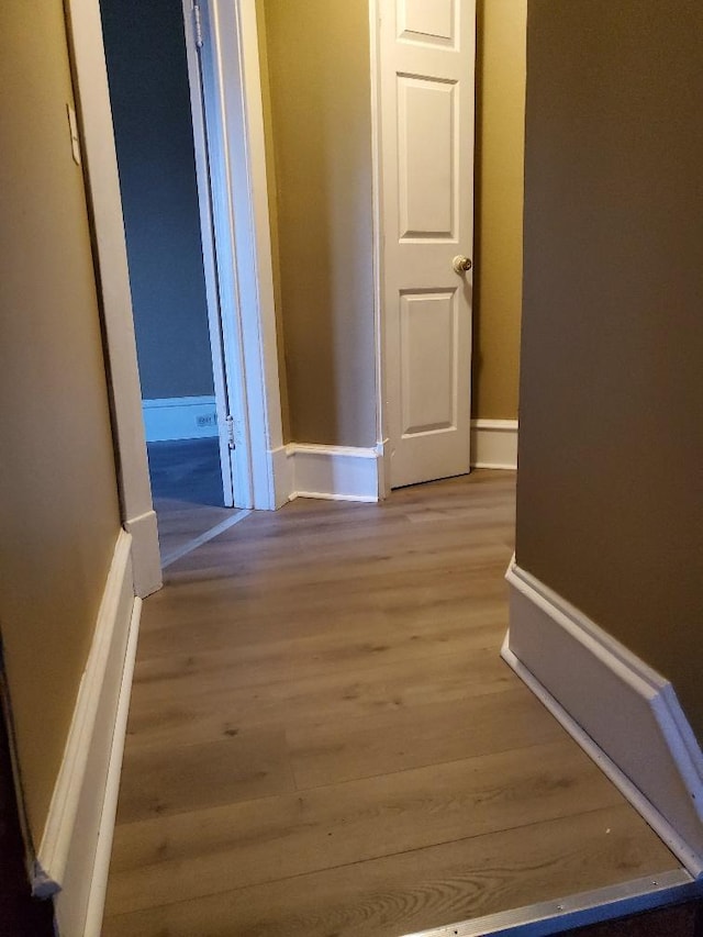 4422 Bryant Ave N, Minneapolis, MN 55412 - corridor with light wood-style flooring and baseboards