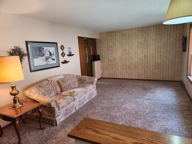 living room featuring wallpapered walls and carpet floors