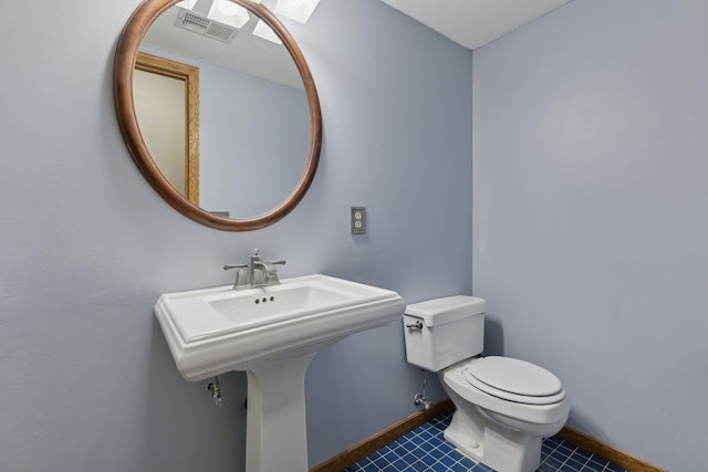 14870 Endicott Way Unit 20, Apple Valley, MN 55124 - bathroom with tile patterned flooring, toilet, and baseboards