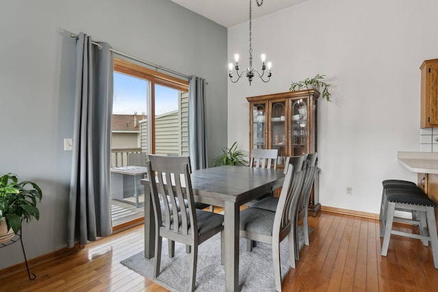 14870 Endicott Way Unit 20, Apple Valley, MN 55124 - dining room with hardwood / wood-style floors, a chandelier, and baseboards