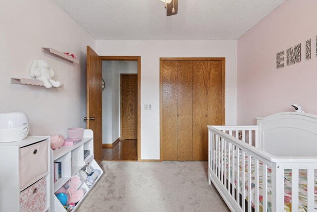 14870 Endicott Way Unit 20, Apple Valley, MN 55124 - carpeted bedroom featuring a nursery area, ceiling fan, and a textured ceiling