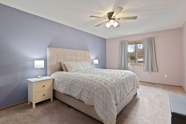 14870 Endicott Way Unit 20, Apple Valley, MN 55124 - bedroom featuring light carpet, baseboards, a ceiling fan, and a textured ceiling