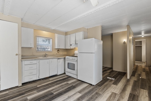 501 Forest St Unit 18, Belle Plaine, MN 56011 - kitchen with white appliances, dark wood finished floors, under cabinet range hood, white cabinetry, and light countertops