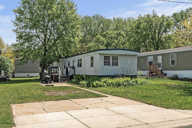 501 Forest St Unit 18, Belle Plaine, MN 56011 - manufactured / mobile home with a front yard