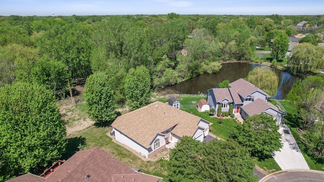 aerial overview of property's location with a large body of water and a forest