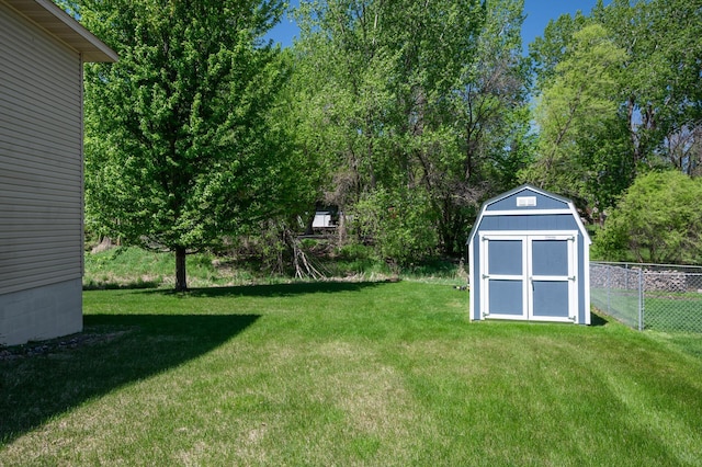 view of yard with a storage unit and an outbuilding