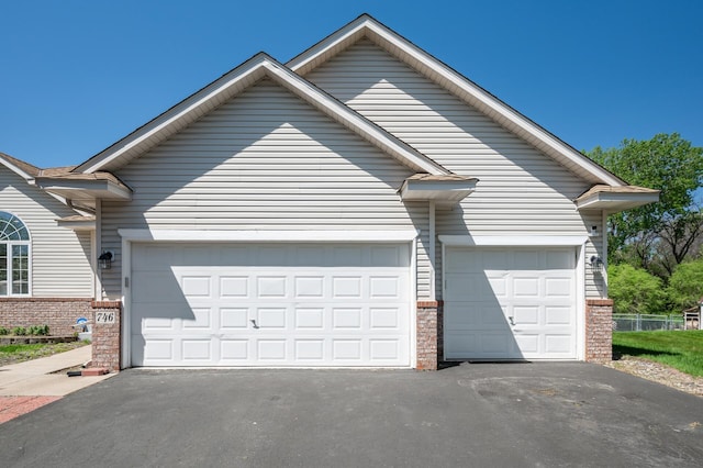 garage with asphalt driveway