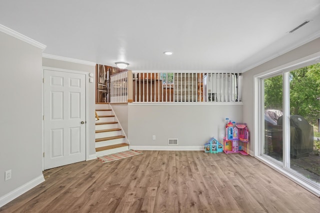 rec room featuring ornamental molding, wood finished floors, baseboards, and recessed lighting