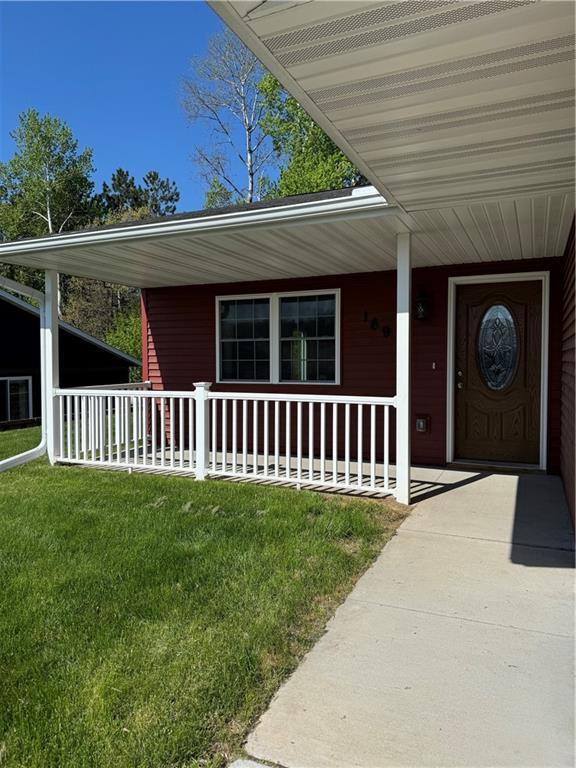 169 Amber View St, Menomonie, WI 54751 - view of exterior entry with a porch and a lawn
