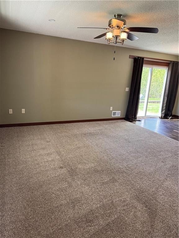 169 Amber View St, Menomonie, WI 54751 - carpeted empty room with ceiling fan, baseboards, and a textured ceiling