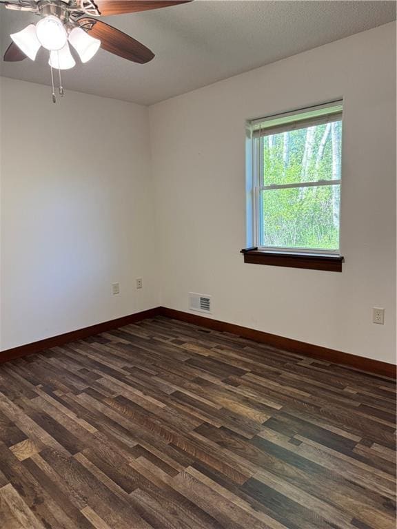 169 Amber View St, Menomonie, WI 54751 - empty room featuring dark wood-style flooring, ceiling fan, and baseboards