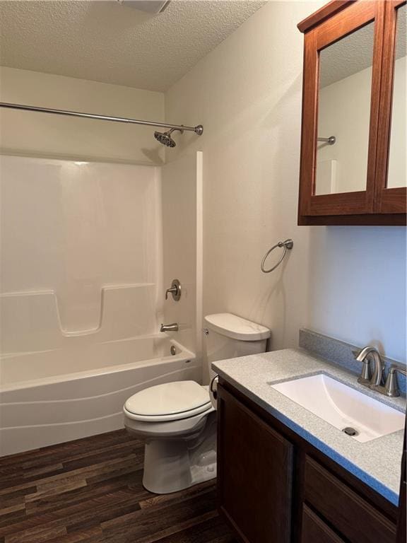 169 Amber View St, Menomonie, WI 54751 - full bath with wood finished floors, a textured ceiling, toilet, bathtub / shower combination, and vanity