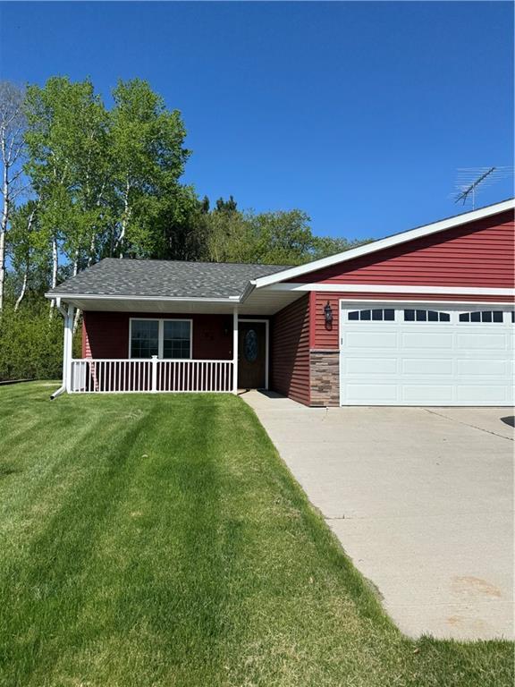 169 Amber View St, Menomonie, WI 54751 - view of front of house featuring a front yard, driveway, a porch, and a garage
