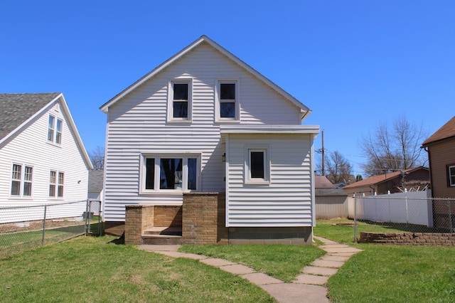 2612 3rd Ave W, Hibbing, MN 55746 - rear view of property featuring a fenced backyard