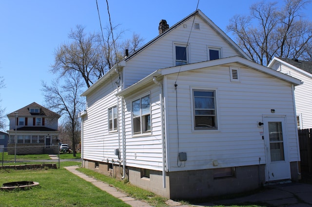 2612 3rd Ave W, Hibbing, MN 55746 - back of house featuring a chimney