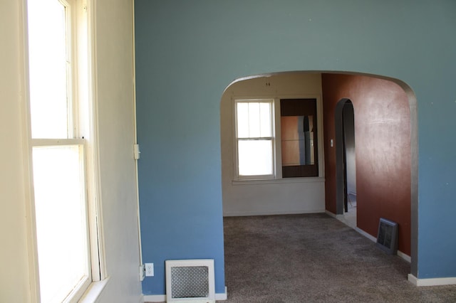 2612 3rd Ave W, Hibbing, MN 55746 - spare room with arched walkways and carpet floors