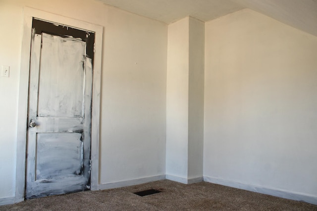 2612 3rd Ave W, Hibbing, MN 55746 - spare room featuring carpet and lofted ceiling