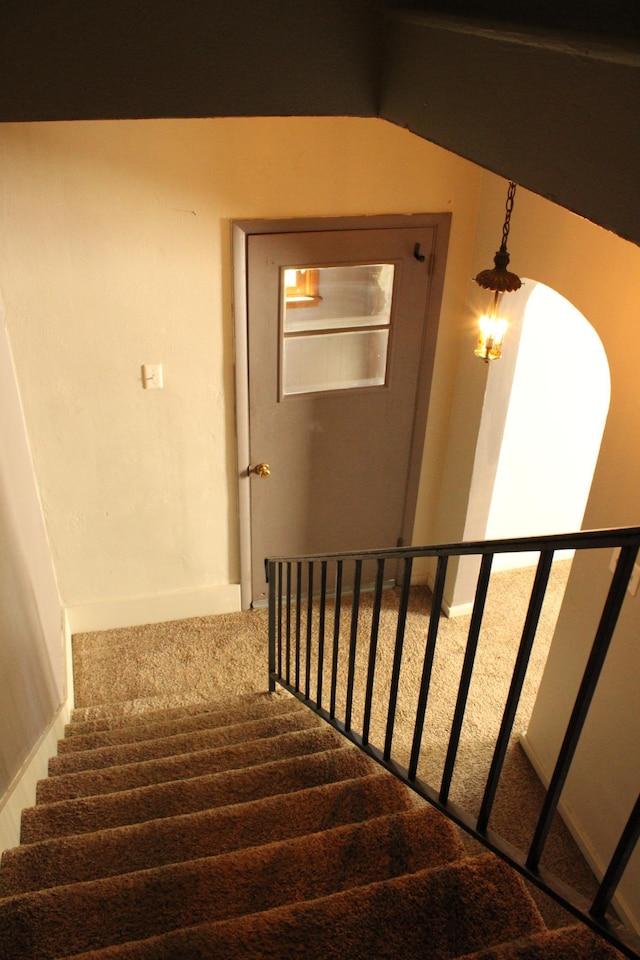 2612 3rd Ave W, Hibbing, MN 55746 - staircase featuring carpet and vaulted ceiling