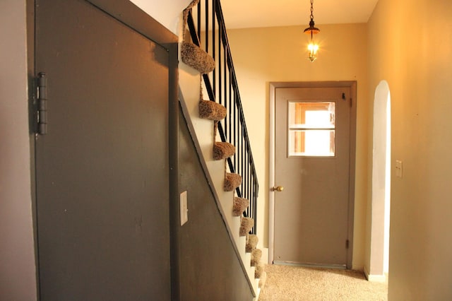 2612 3rd Ave W, Hibbing, MN 55746 - doorway with stairway, light colored carpet, and arched walkways
