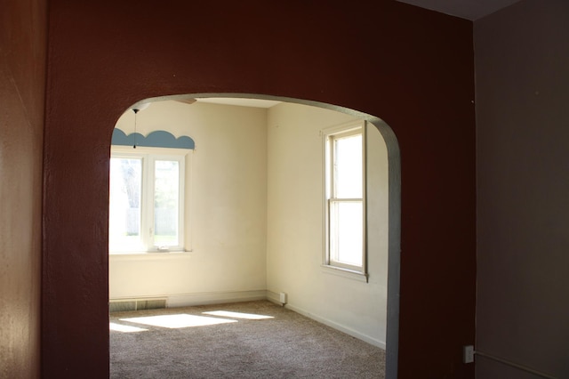2612 3rd Ave W, Hibbing, MN 55746 - unfurnished room featuring arched walkways and carpet