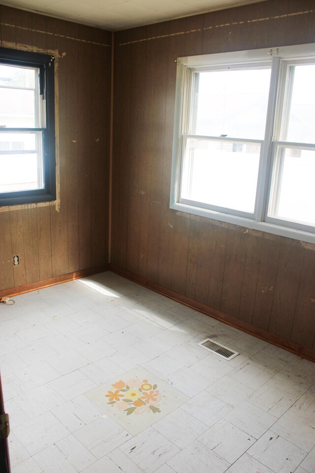 2612 3rd Ave W, Hibbing, MN 55746 - unfurnished room with light flooring and wood walls