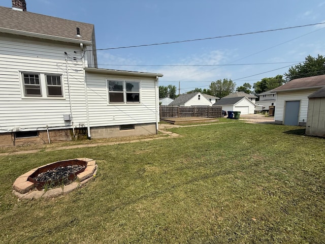 2612 3rd Ave W, Hibbing, MN 55746 - view of yard featuring a fire pit and a garage