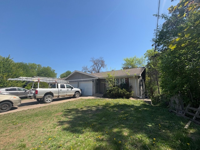 single story home with a garage, brick siding, and driveway