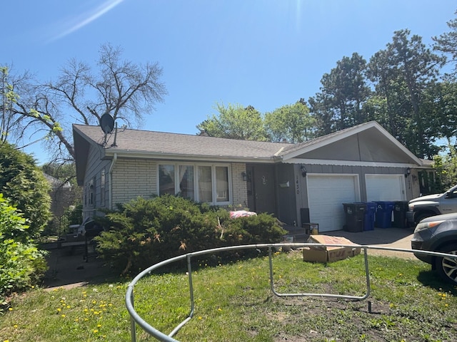 ranch-style house with brick siding, a garage, and board and batten siding