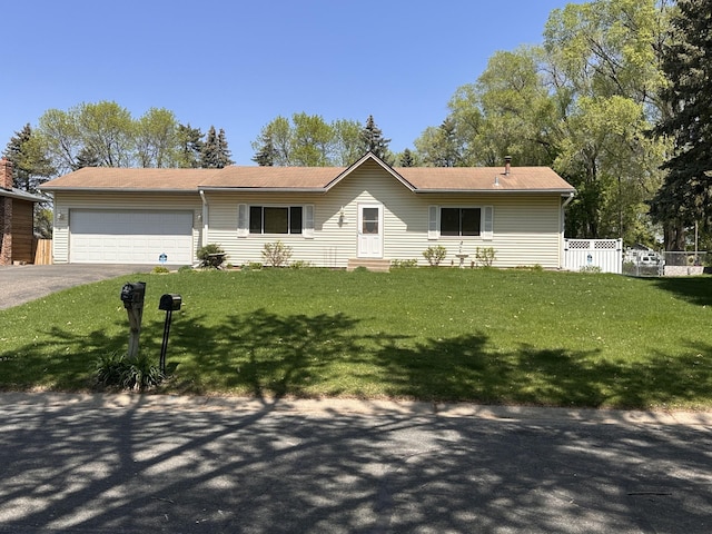 ranch-style house with a garage, driveway, and entry steps