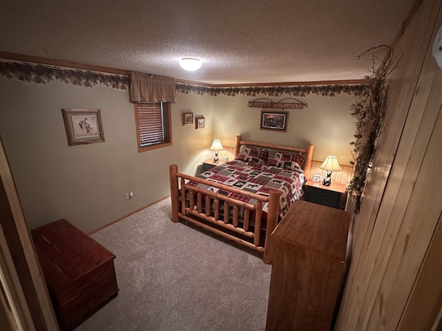 carpeted bedroom featuring a textured ceiling and baseboards