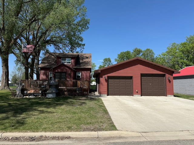 303 4th St S, Hoffman, MN 56339 - view of front of house featuring a front lawn, an outdoor structure, a deck, and a garage