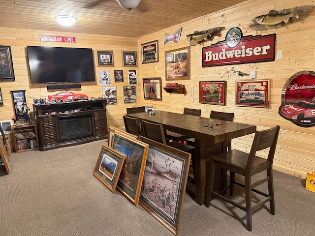 303 4th St S, Hoffman, MN 56339 - carpeted dining area featuring wood walls and wood ceiling