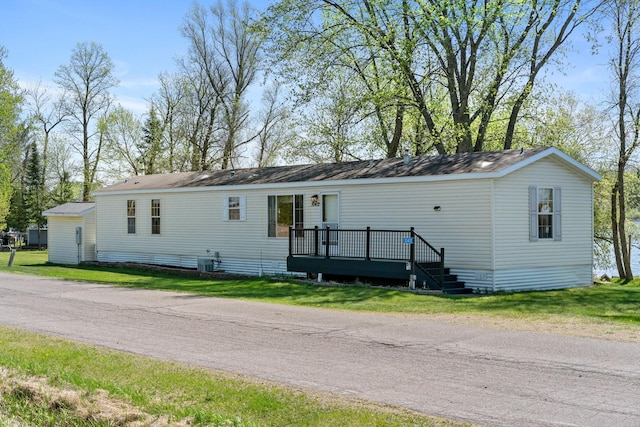 10412 Lakeside Dr, Pine Lake Twp, MN 55735 - manufactured / mobile home with a wooden deck and a front lawn
