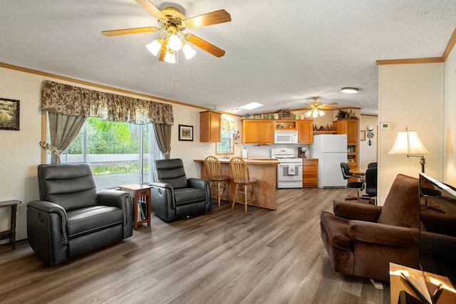 10412 Lakeside Dr, Pine Lake Twp, MN 55735 - living room featuring ceiling fan, light wood-style floors, ornamental molding, a textured ceiling, and lofted ceiling